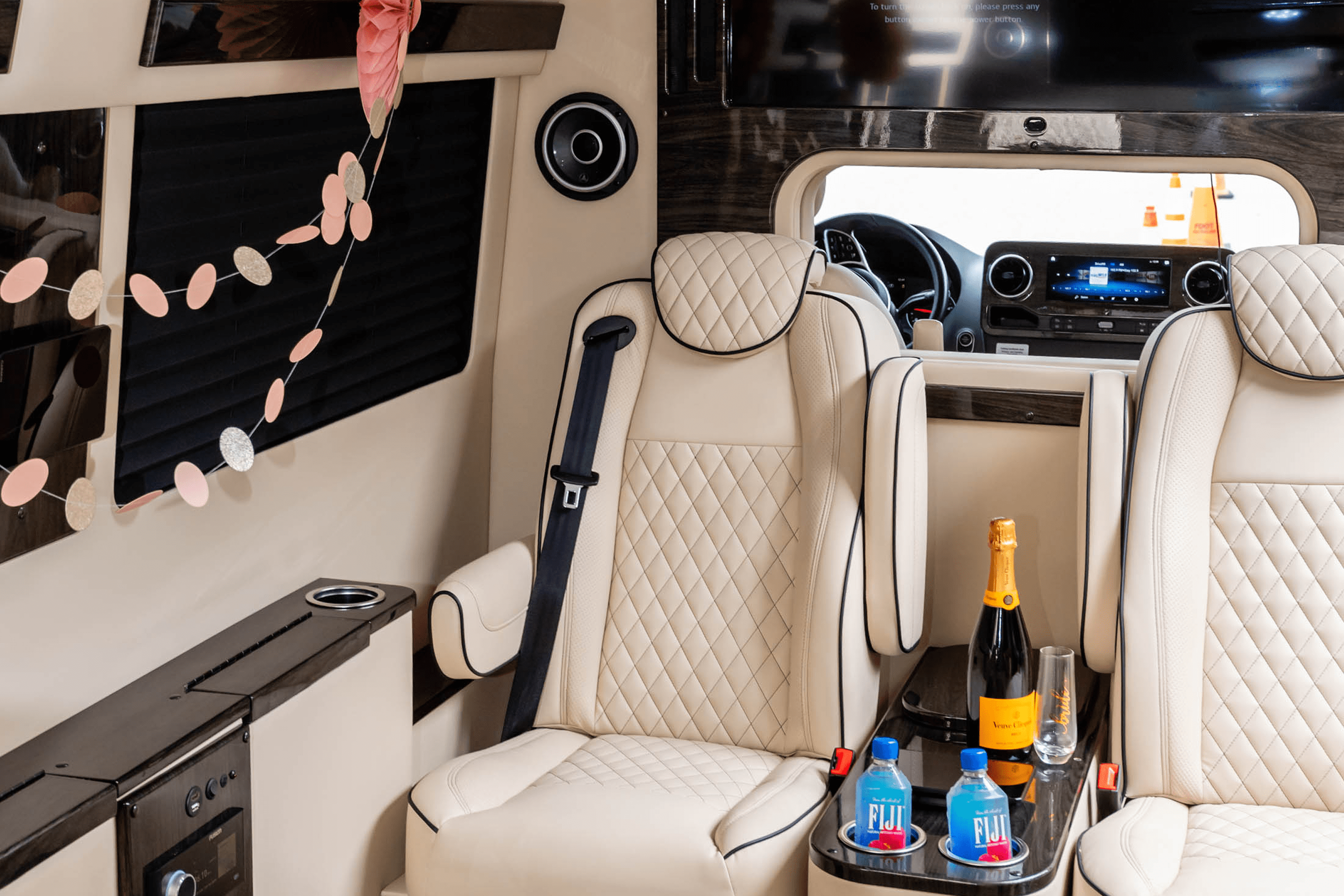 Luxury cabin seats with champagne and water