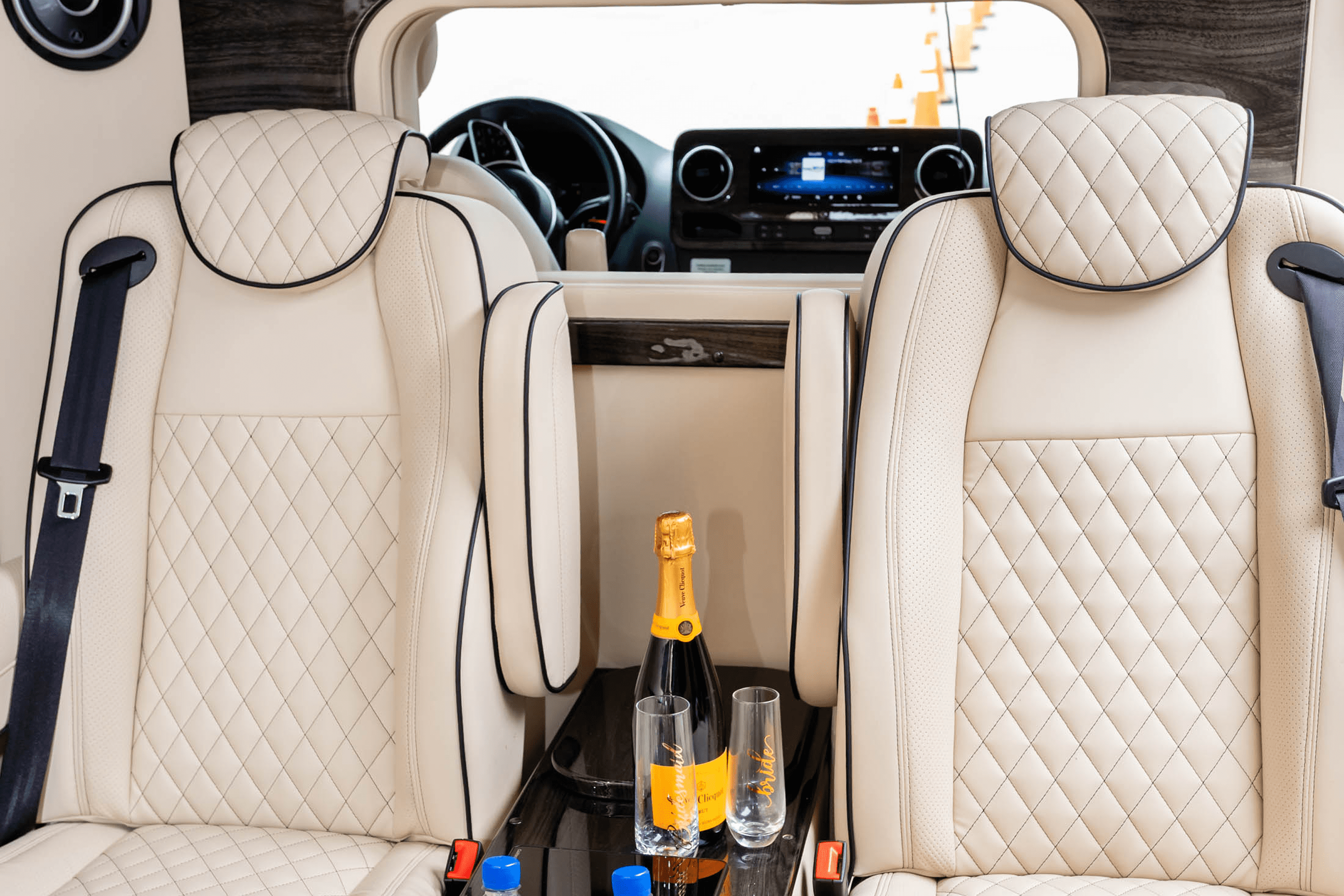 Luxury vehicle interior with champagne and glasses
