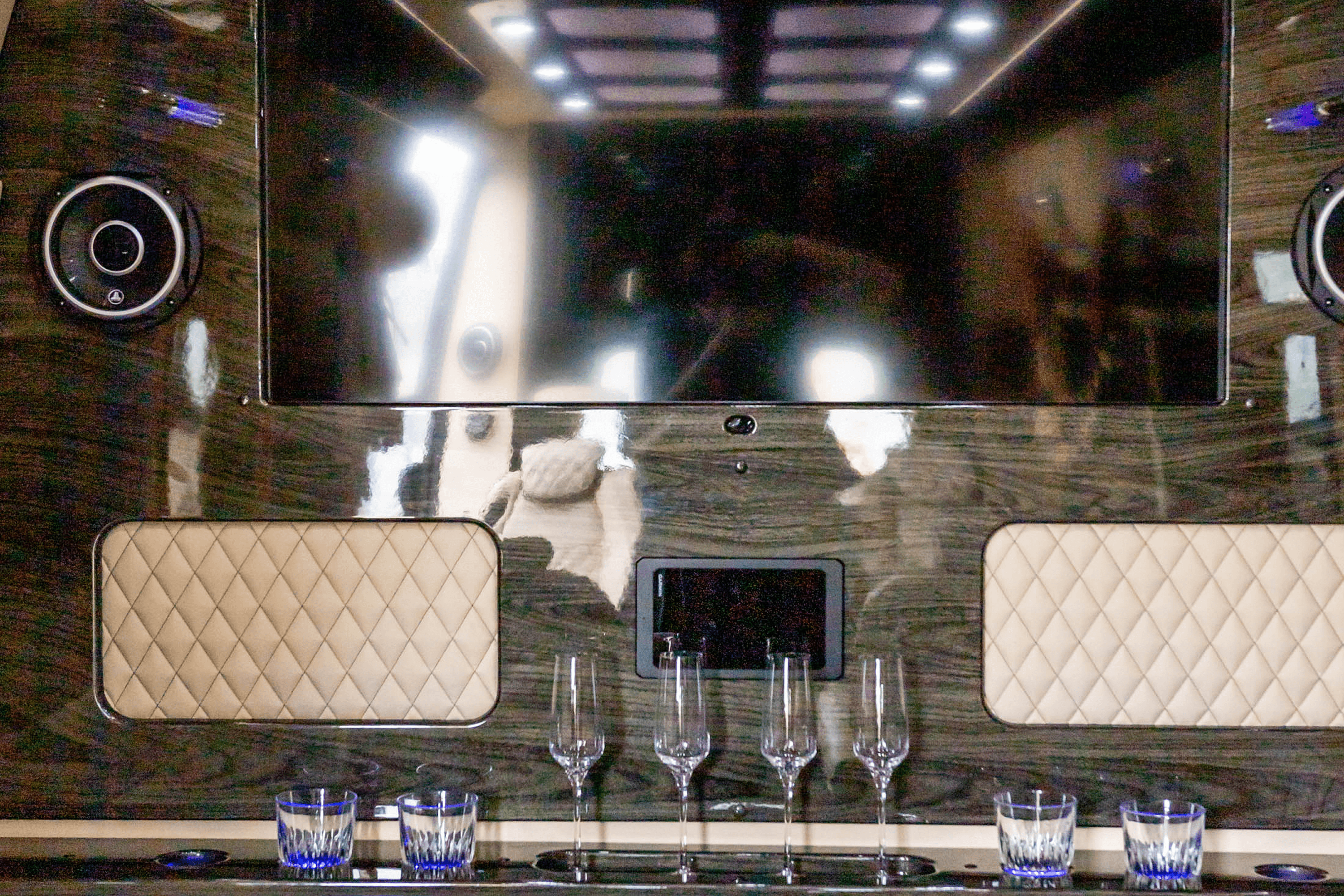 Luxury cabin interior with glassware and screen