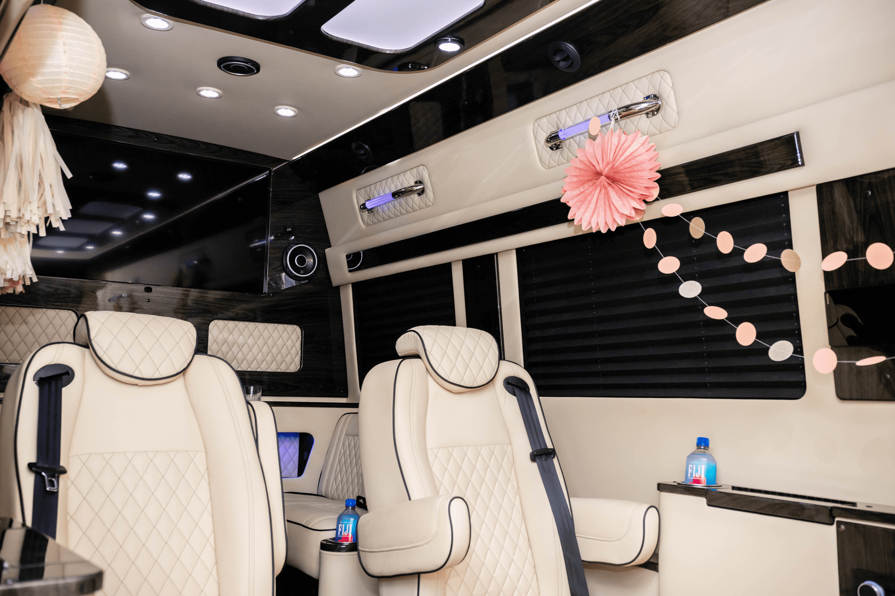 Luxury van interior with cream seats, pink decorations