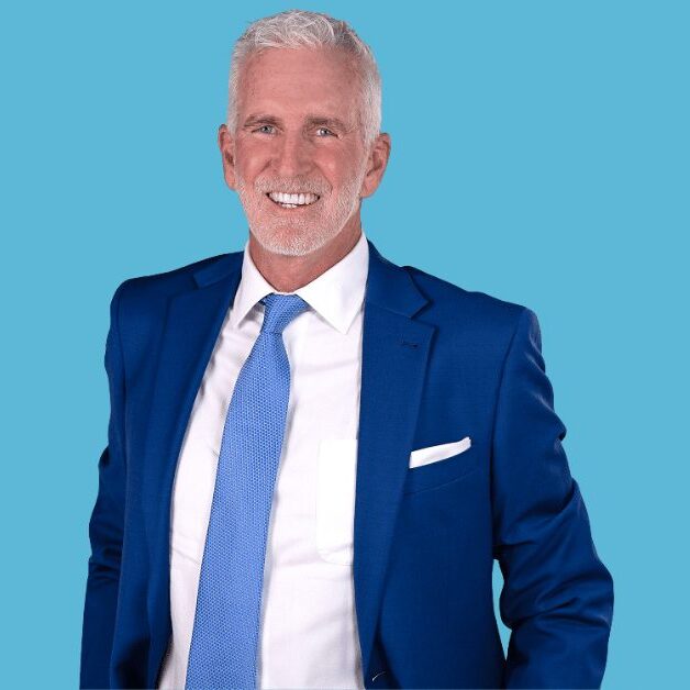 Smiling older businessman in blue suit